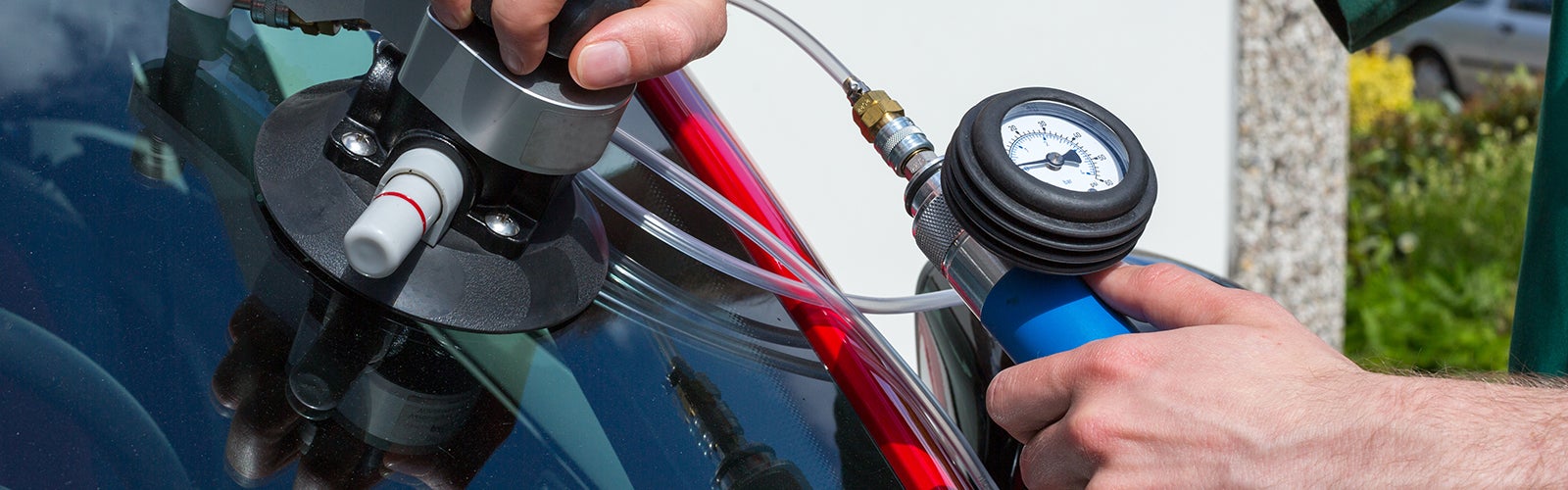 Avalon Honda Technician in the process of removing wind shield