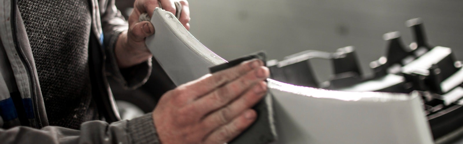 Avalon Honda Technician in the process of removing wind shield